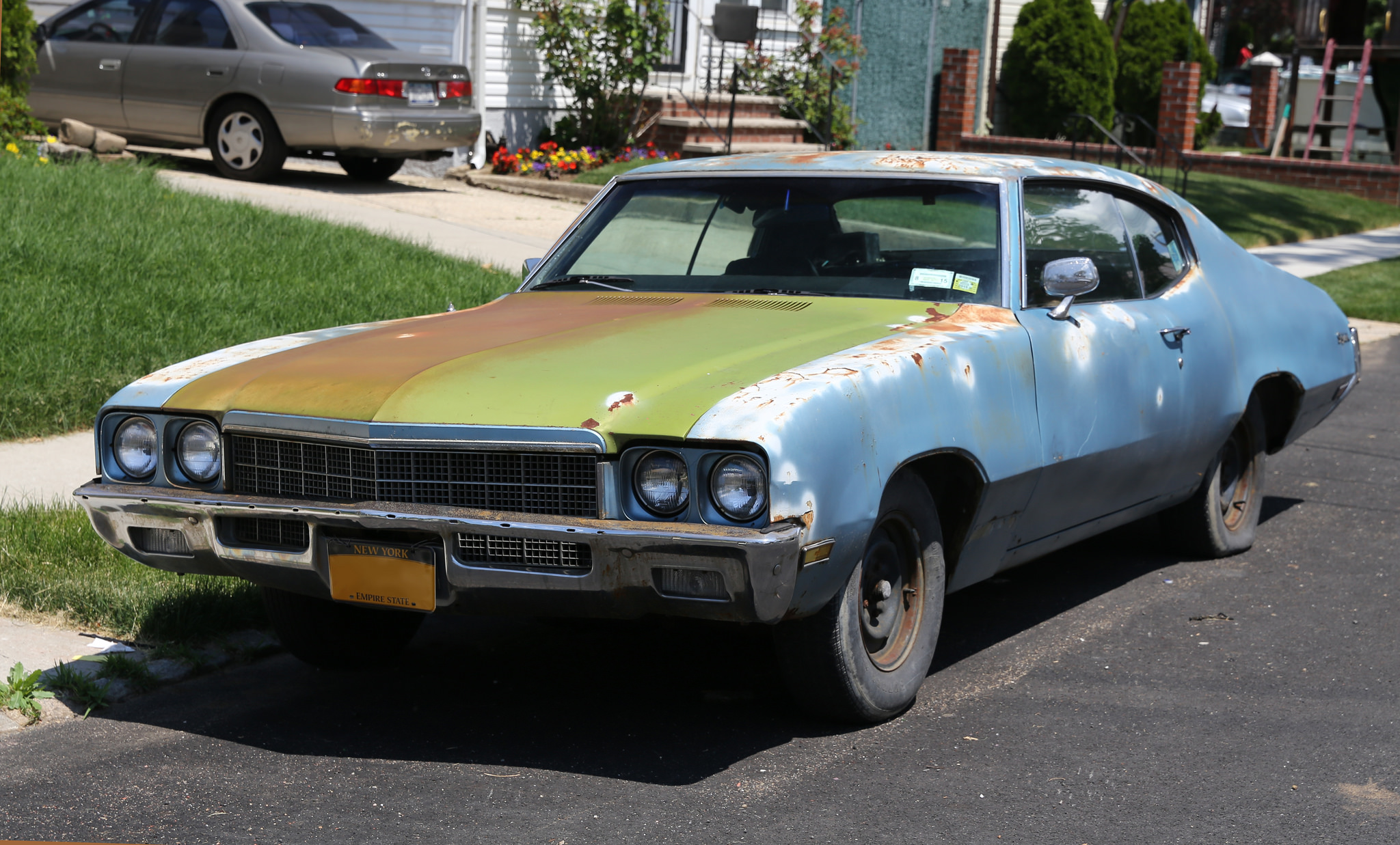 old blue buick on street