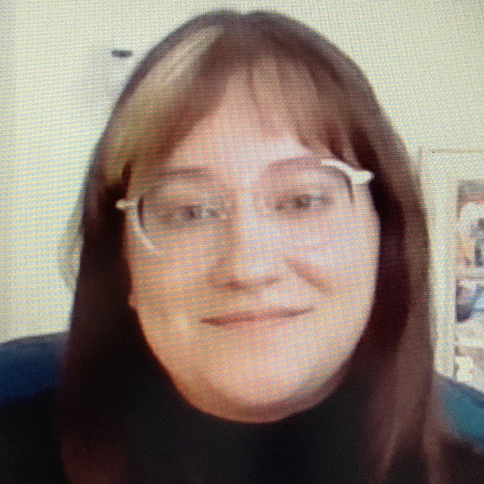 Woman in glasses smiling