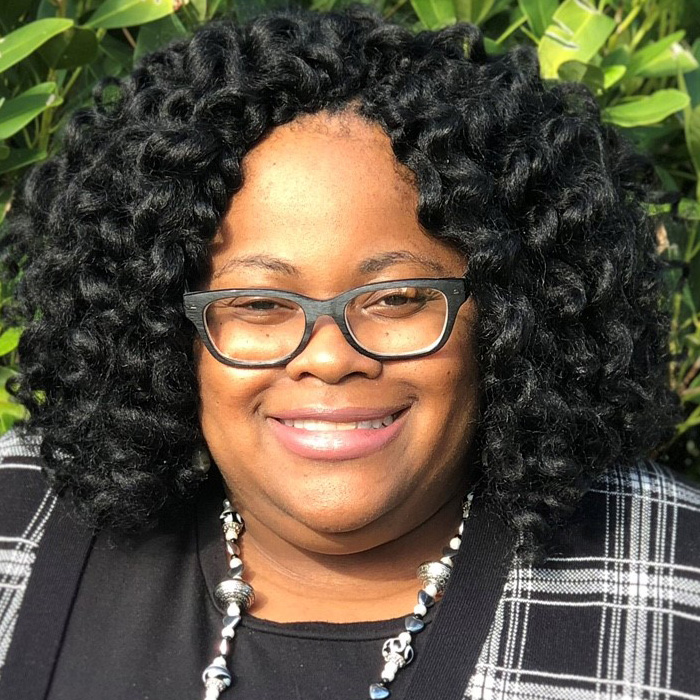 woman in suit smiling