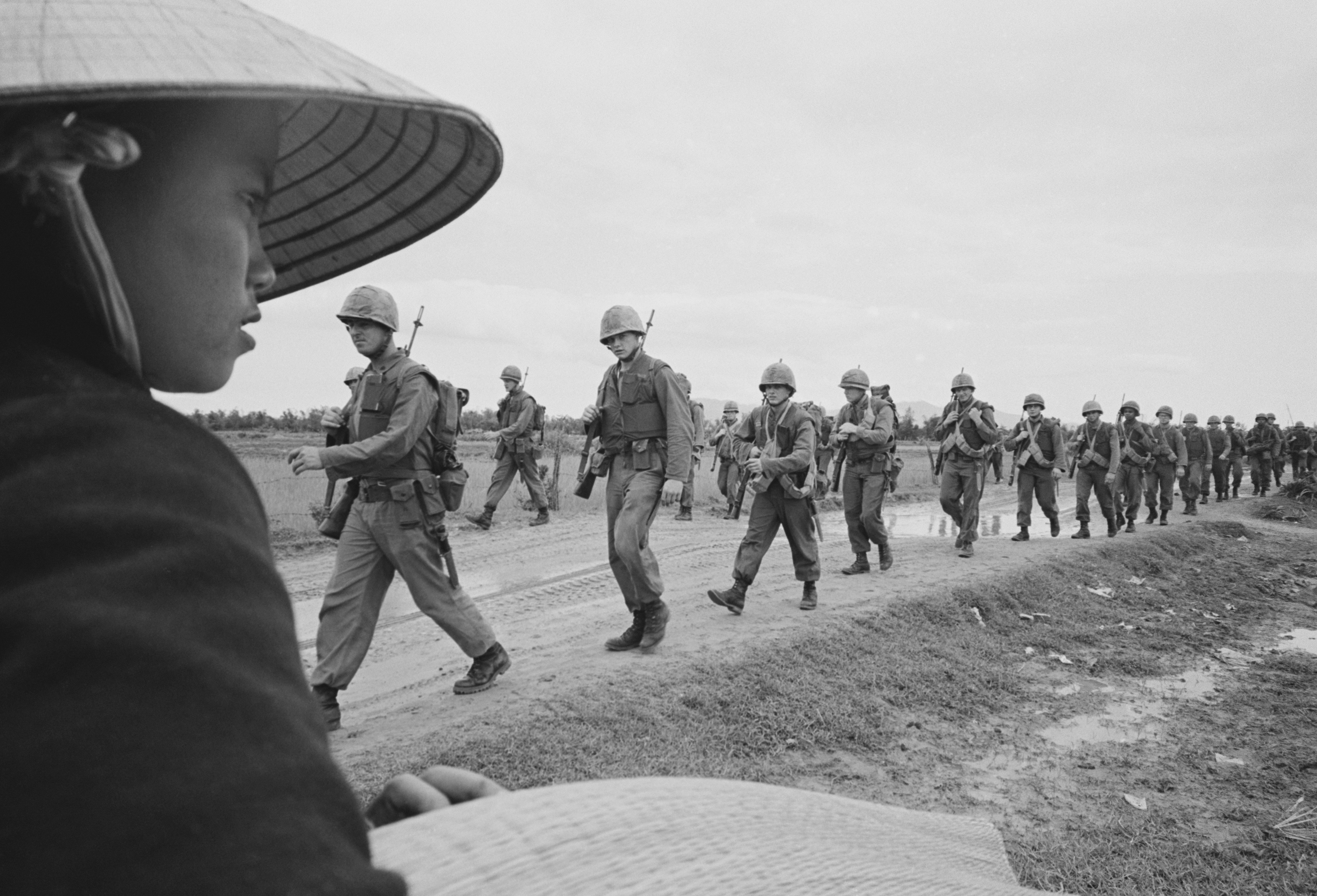 With South Vietnam in chaos, Hanoi accelerates the insurgency, sending combat troops to the South. Fearing Saigon's collapse, President Johnson escalates, authorizing sustained bombing of the North and deploying ground troops in the South.